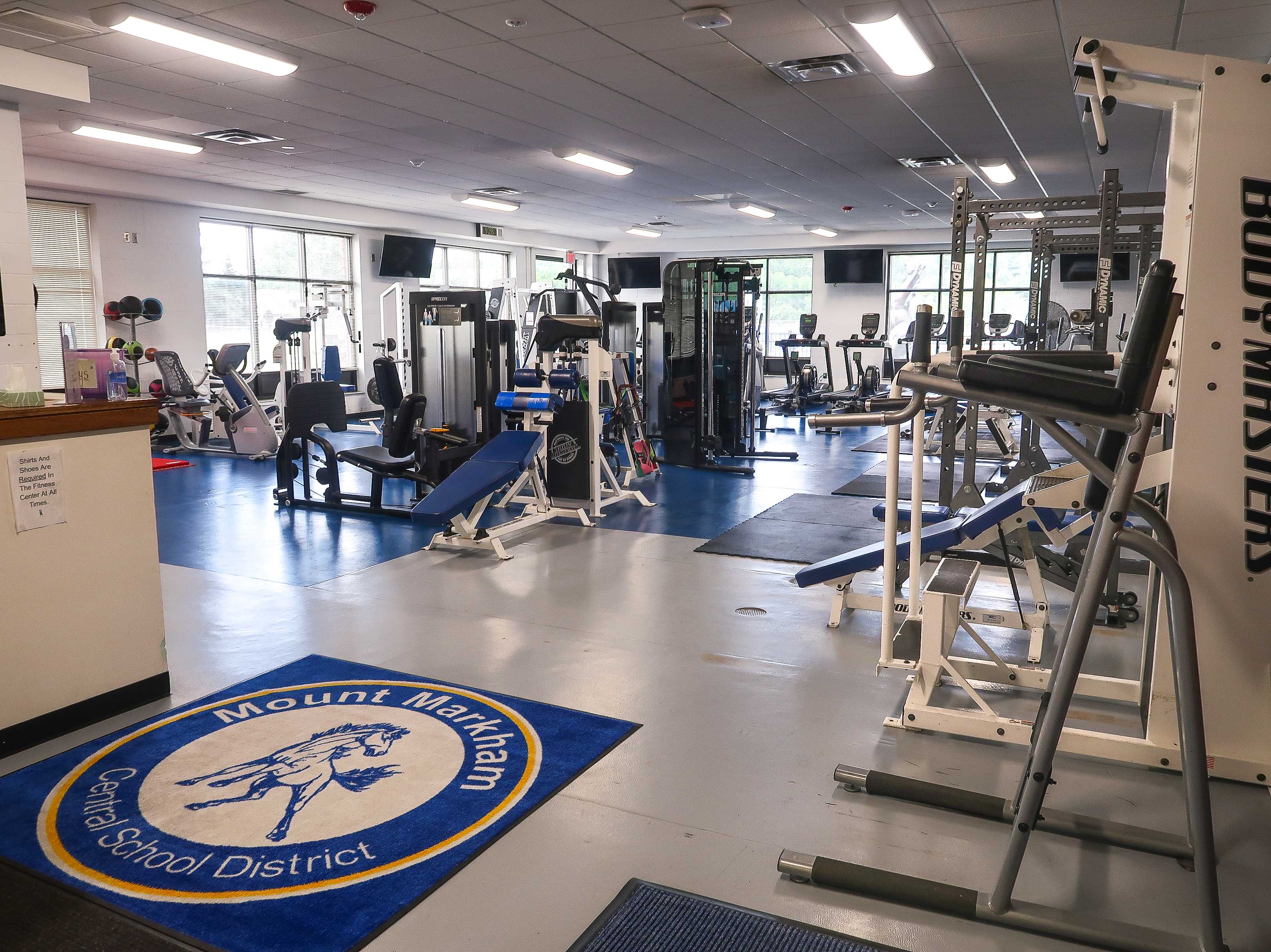 Room filled with exercise equipment. 